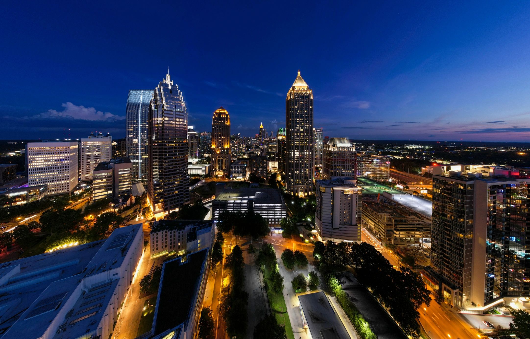City skyline at twilight with illuminated buildings
